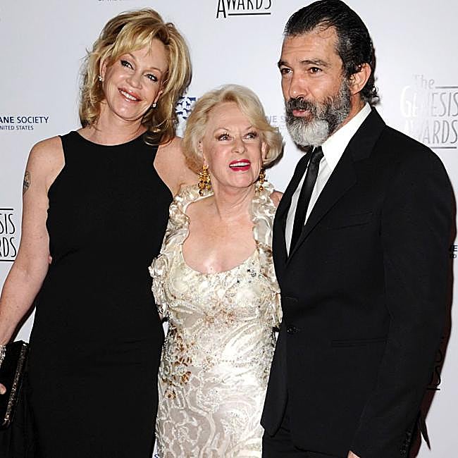 Tippi Hedren with Melanie Griffith and Antonio Banderas at a party.
