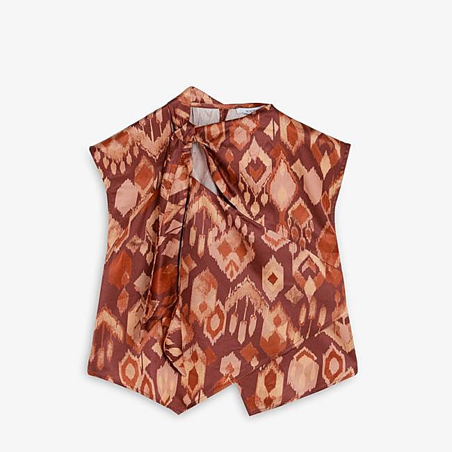 Sleeveless blouse with a printed earth-toned pattern by Scalpers, 69.99 euros.