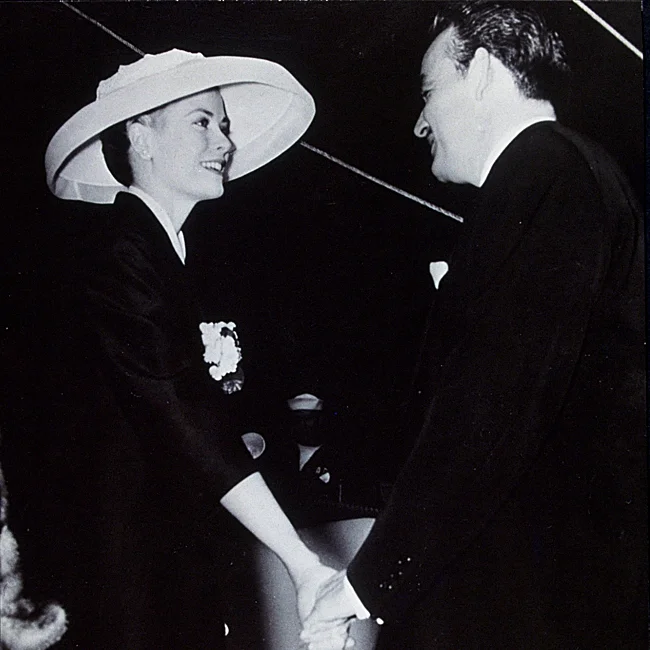 Grace Kelly greets her fiancé as she arrives in Monaco in 1956.