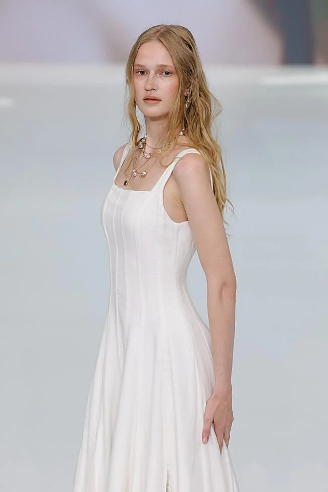 A bridal hairstyle with loose strands.