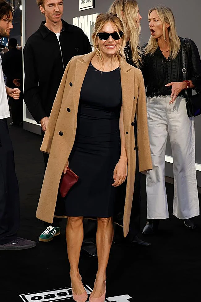Sienna Miller wearing camel coat.
