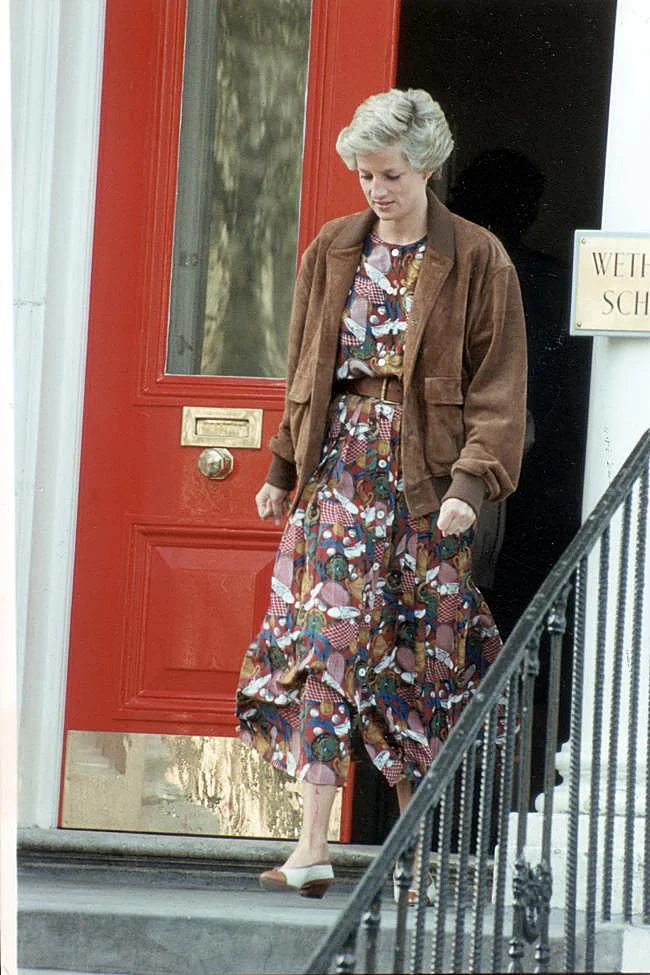 Diana, Princess of Wales, with a printed dress and suede jacket.